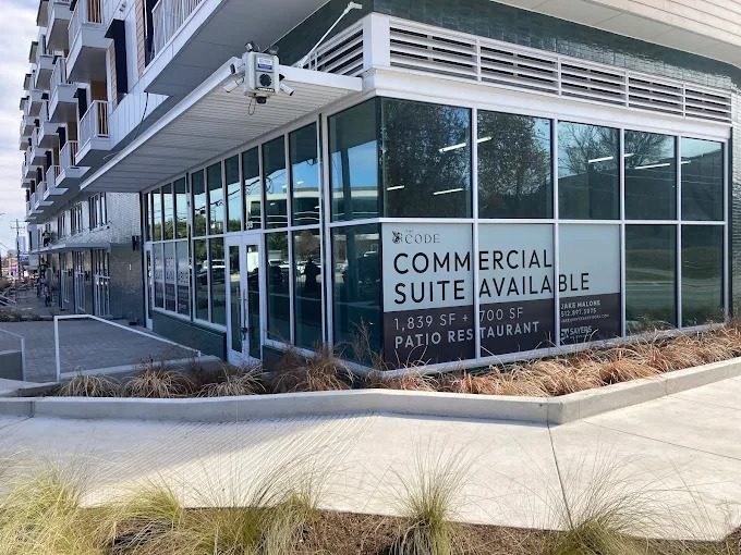 Commercial suite window vinyl installed on street-facing glass.