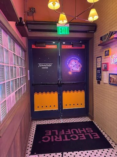 Event door vinyl graphics installed at a venue entrance.