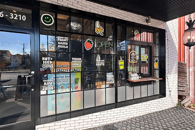 Restaurant window graphics with colorful decal shapes.