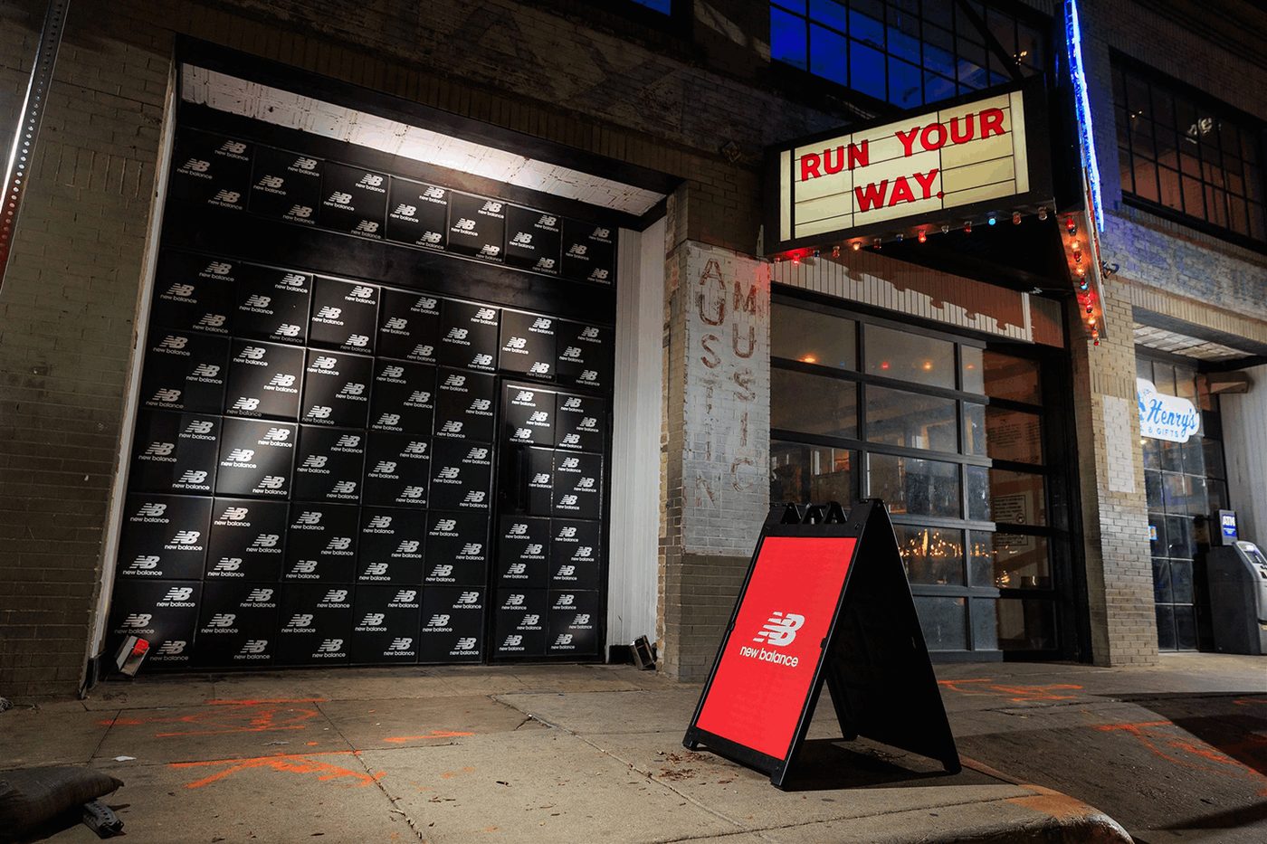 Exterior event signage with A-frame and branded backdrop graphics.