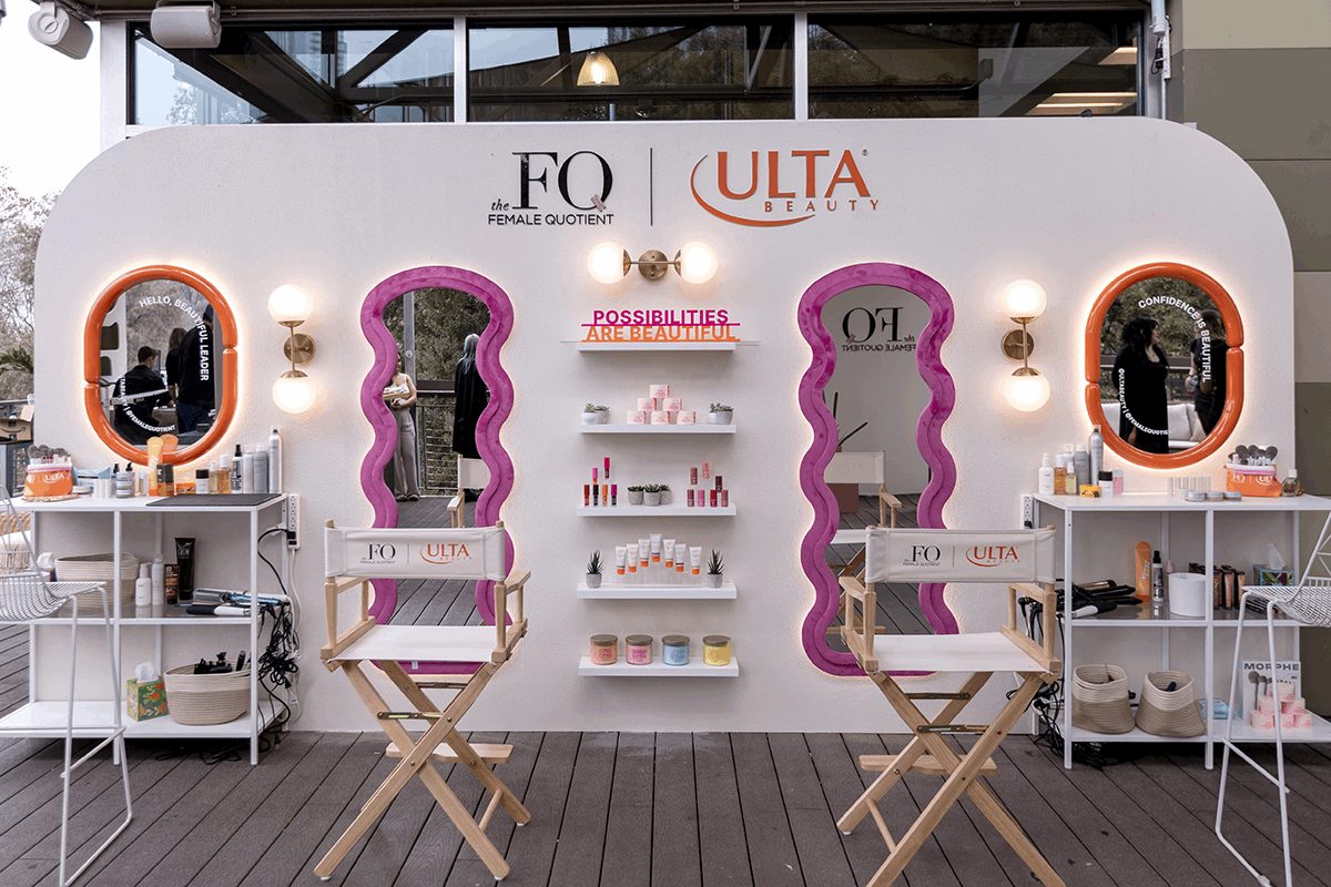 Branded beauty activation display with printed graphics.
